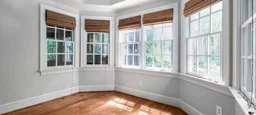 Glass windows with blinds and off white wall